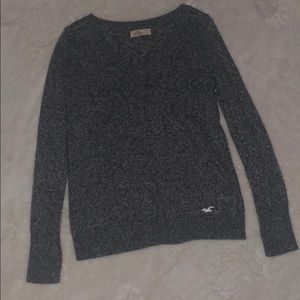 Gray woman’s v-neck sweater